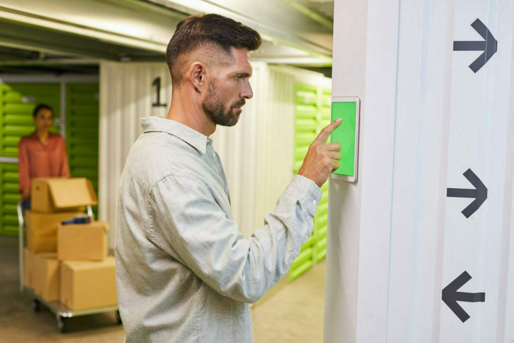 a man holding a green card