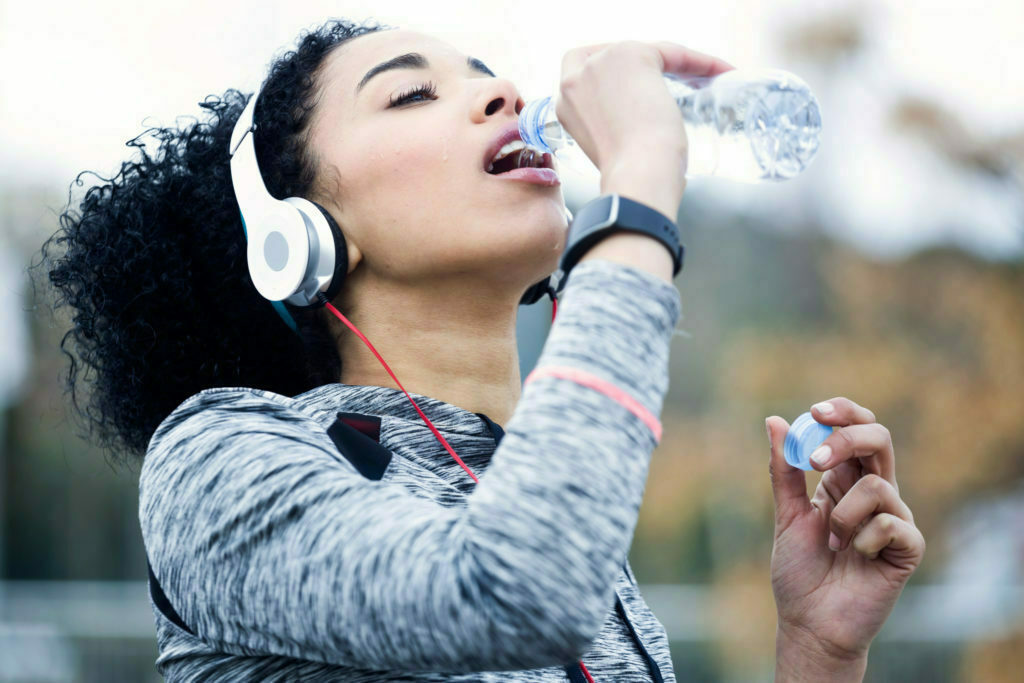 a person wearing headphones and holding a microphone